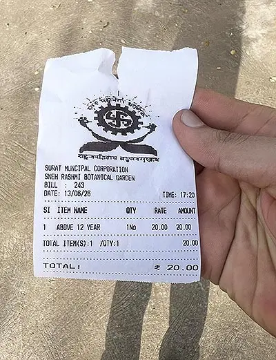 Sneh Rashmi Botanical Garden Surat entry ticket of Rs 20 per person held in hand