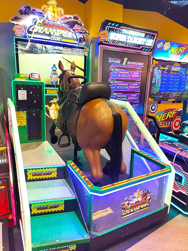 Derby Champion horse riding arcade game at VR Mall Surat game zone, beside a Nerf Arcade machine