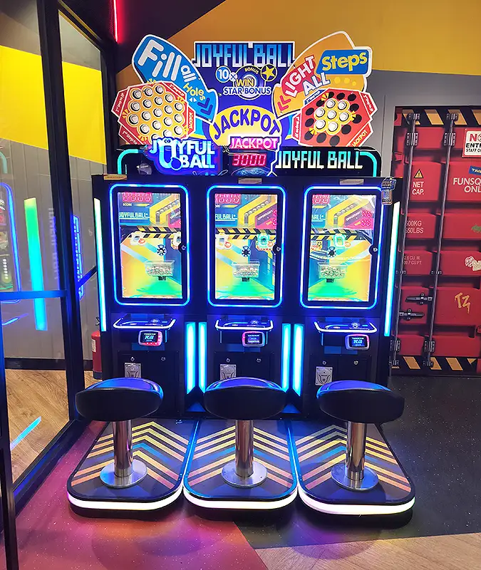 Joyful Ball jackpot arcade machine with three seats and blue neon screens at Surat VR Mall game zone
