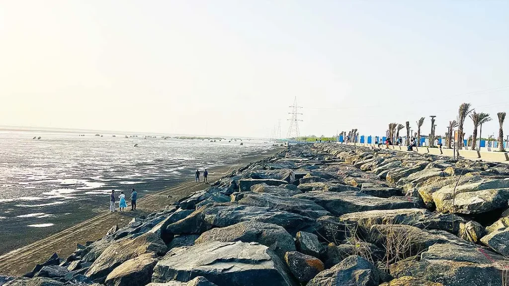Rocky shoreline during low tide at Dumas Sea Face Surat
