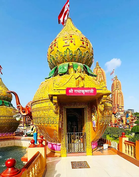 Golden kalash shaped Radha Krishna small mandir at Gurukul Surat