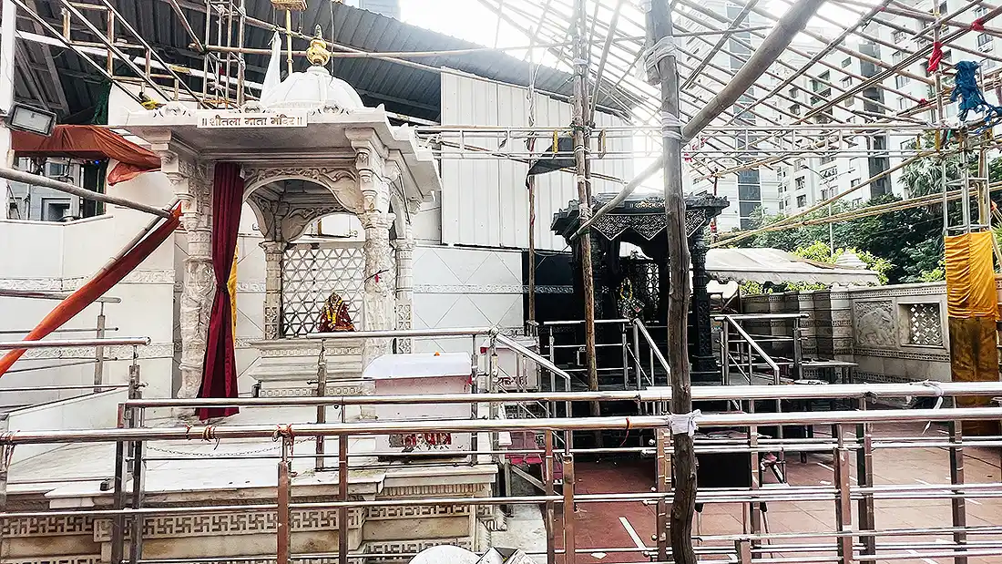 Two smaller shrines behind Shyam Baba temple, a marble Shitla Mata Mandir and a dark carved Shani Dev shrine