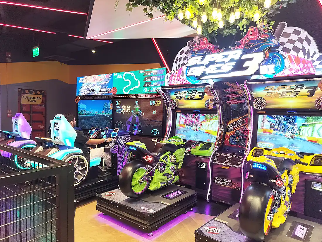 Super Bikes 3 motorbike racing simulators at VR Mall Surat arcade, with car racing games and Funsquad Zone behind