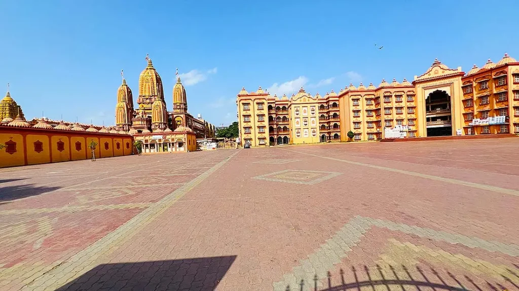 Swaminarayan Gurukul Surat mandir spires on left with gurukul school building on right