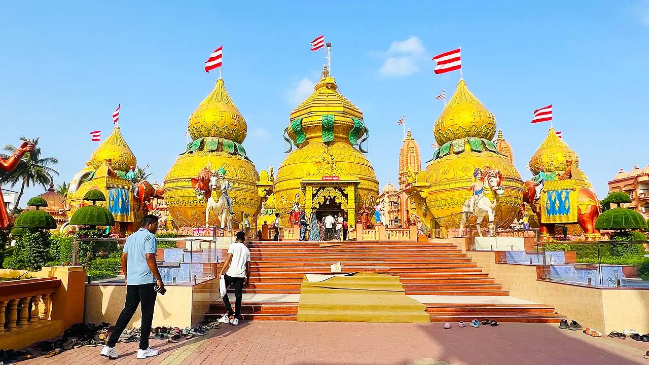 Swaminarayan Gurukul Surat golden kalash domes at Ved Road with visitors