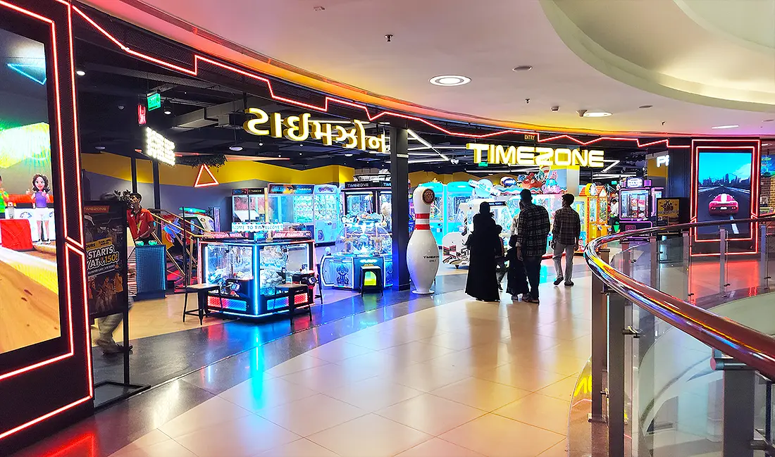 Timezone gaming arcade at Surat VR Mall with neon lights, claw machines and arcade games on the third floor